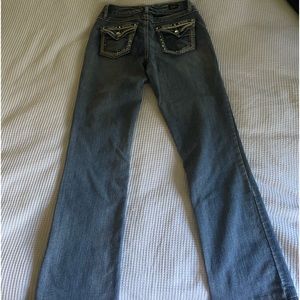 Low rise women’s y2k jeans with gems on the pockets